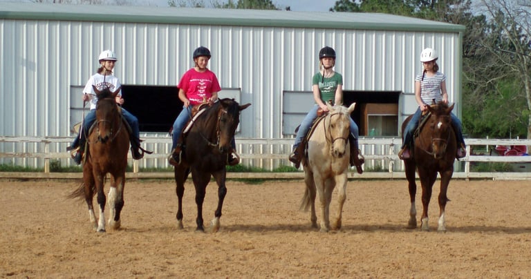 Group horseback riding lesson at Circle Lake Ranch arena
