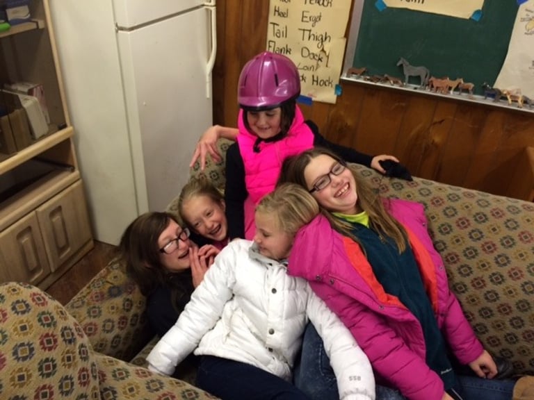 Kids enjoying winter horse camp activities at Circle Lake Ranch